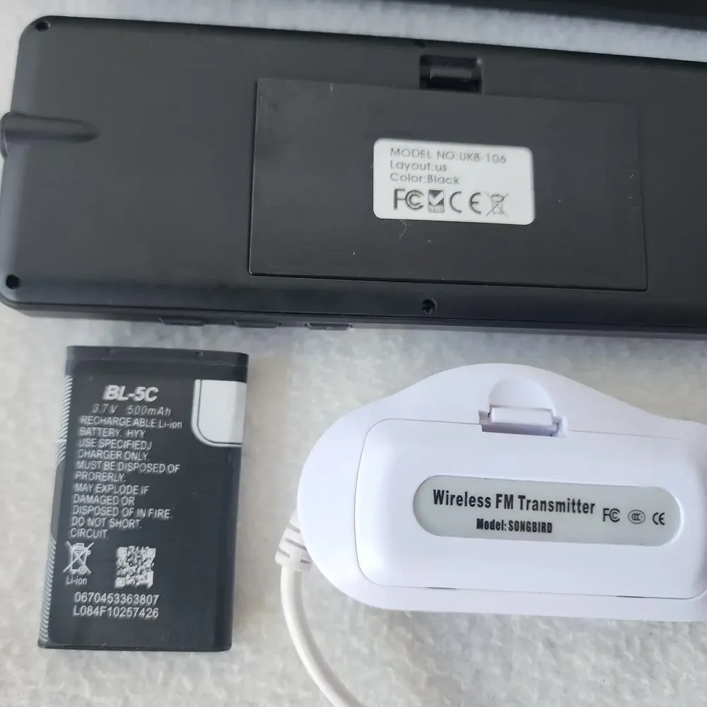 Four Merlin gadgets portable scanner keyboard projector amfm transmitter